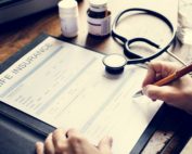 close-up-of-hand-signing-life-insurance-paper-form