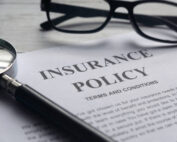 Insurance agent selling final expense coverage remotely with laptop and headset