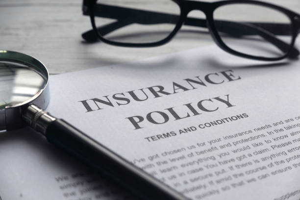 Insurance agent selling final expense coverage remotely with laptop and headset