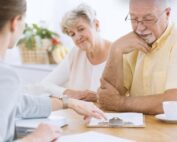 Senior couple reviewing final expense life insurance options with an advisor