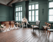 Funeral home interior setup with casket and floral arrangements